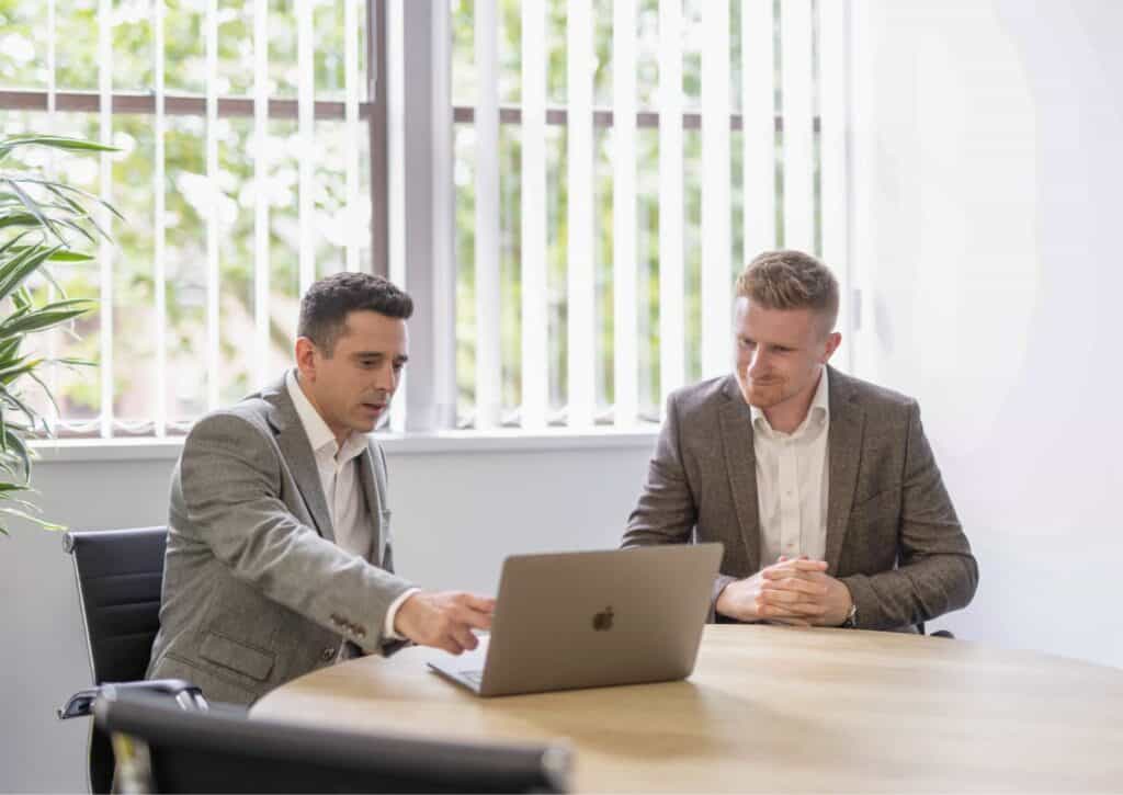 Two colleagues discussing exit planning strategies